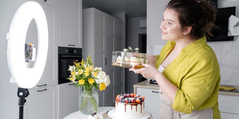 Creator economy: Woman posing with a cake