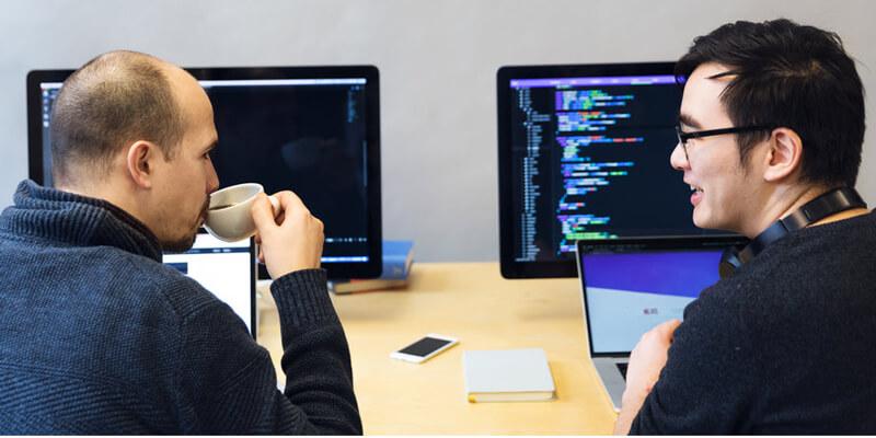 Developers discussing javascript code