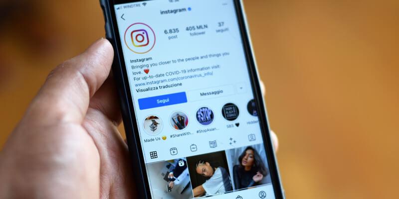 Man checking out Instagram profile