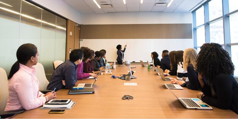 Woman giving presentation in a meeting