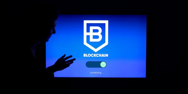 Man connecting blockchain on a screen